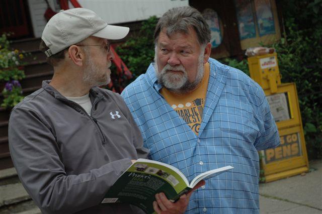 Image Viewer Local resident John Pierce questions MG Bob Lowe about apple tree pruning at the Master Gardener Information Table